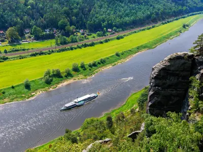 Panoramic scenic view vintage steam paddle boat cruising Elbe river curve at Sachsische Schweiz National Park Germany from Bastei Sandstone mountain valley. Europe travel nature landscape destination.