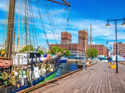 Beautiful City Hall viewed from the pier Oslo Fjord with a beautiful sailing ship in the foreground, Oslo, Norway, Scandinavia