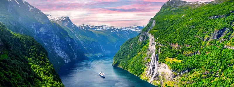 Panorama of breathtaking view of Sunnylvsfjorden fjord and famous Seven Sisters waterfalls, near Geiranger village in western Norway. Landscape photography
